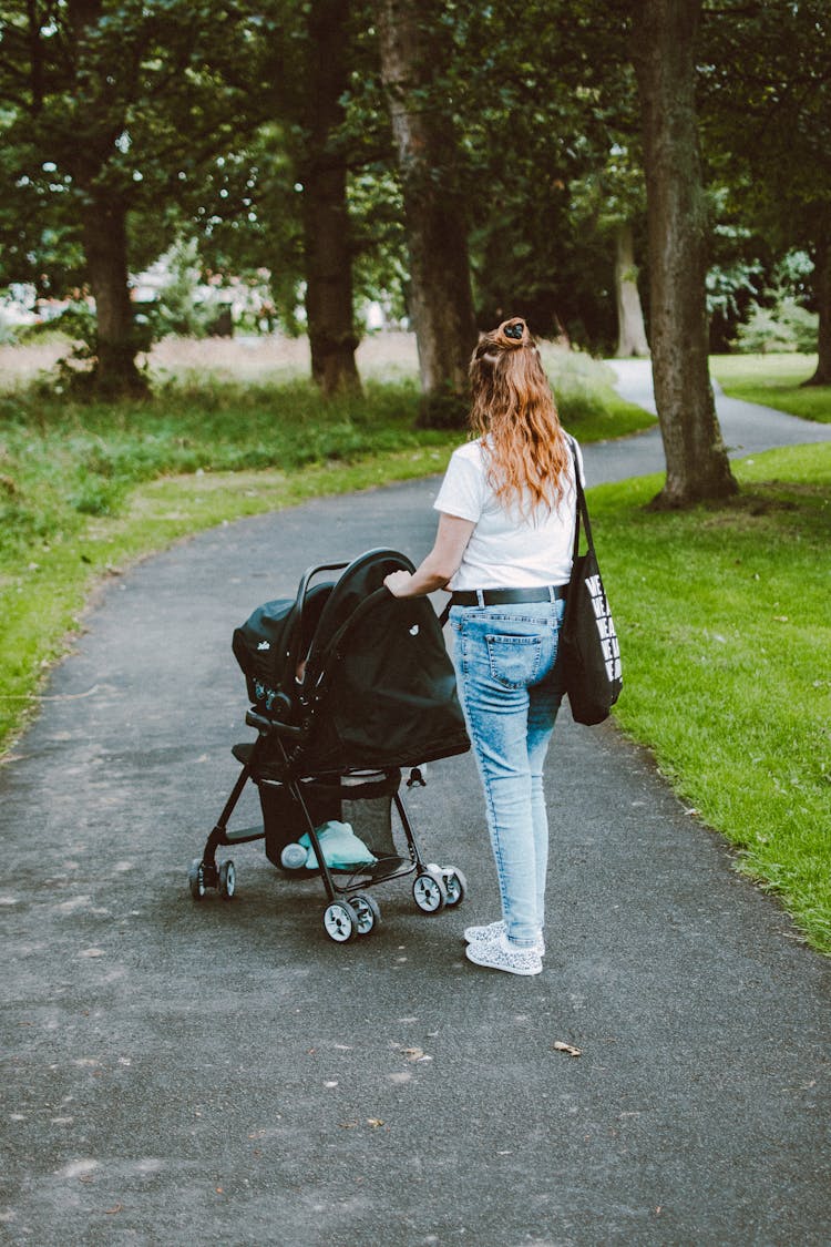 Woman Pushing A Stroller