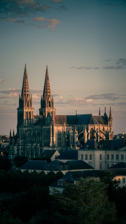 Free Gothic cathedral in Sées, Normandy, France, during sunset, showcasing stunning architecture. Stock Photo
