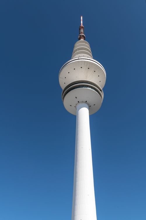 Free Striking view of the iconic Hamburg TV tower under a clear blue sky, showcasing modern architecture. Stock Photo