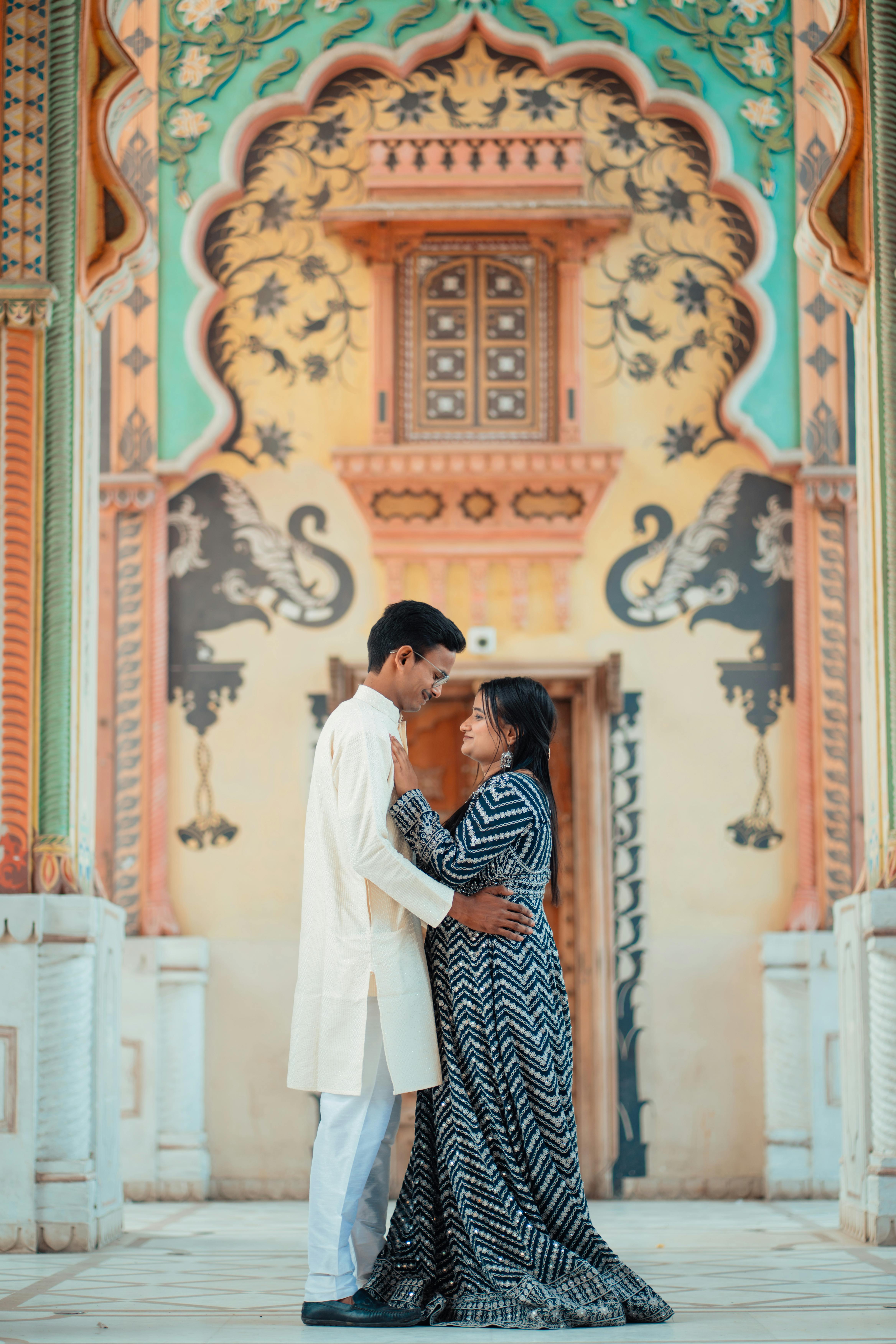 romantic couple s embrace in vibrant traditional indian palace setting