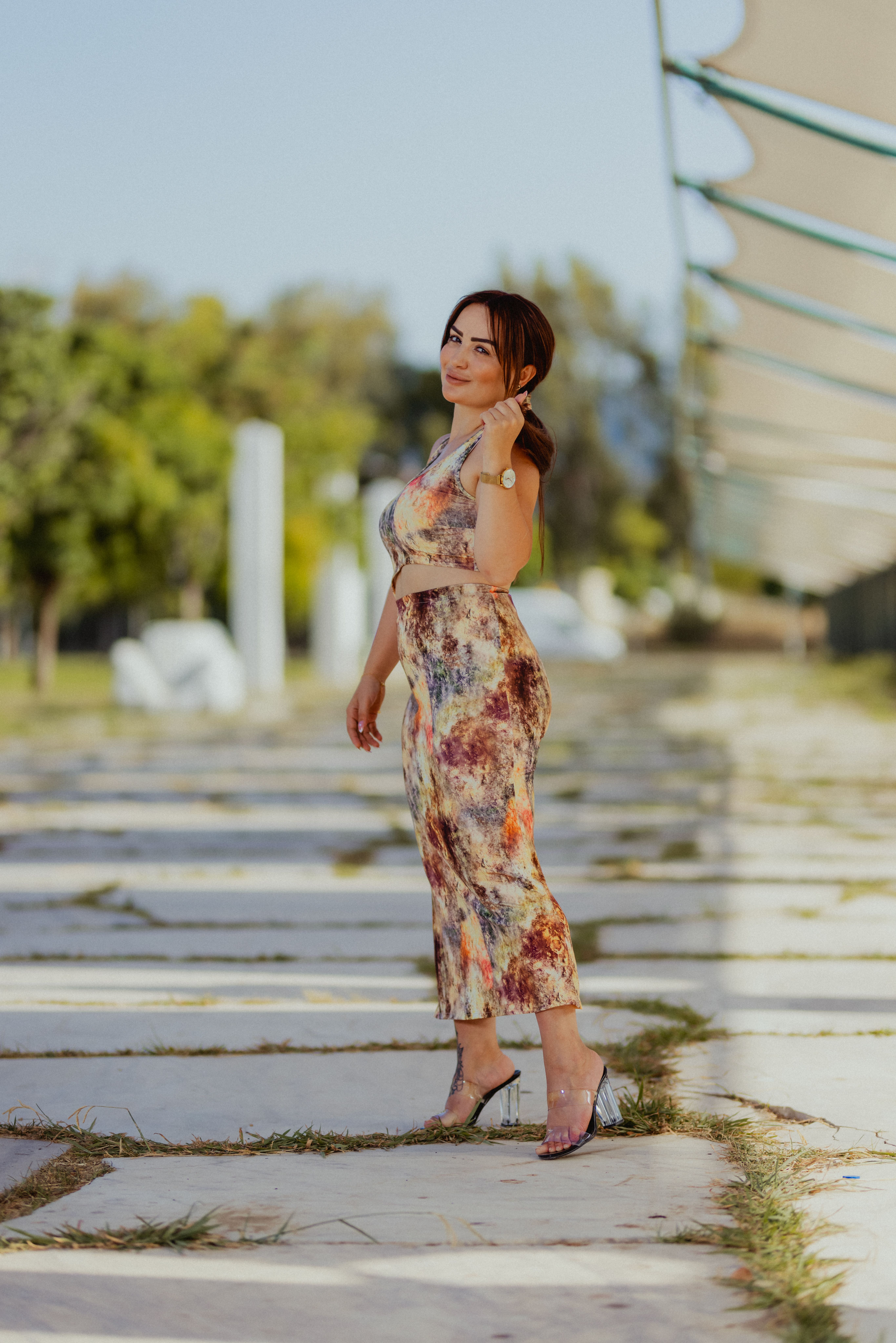 A woman in a floral dress is posing for a photo · Free Stock Photo
