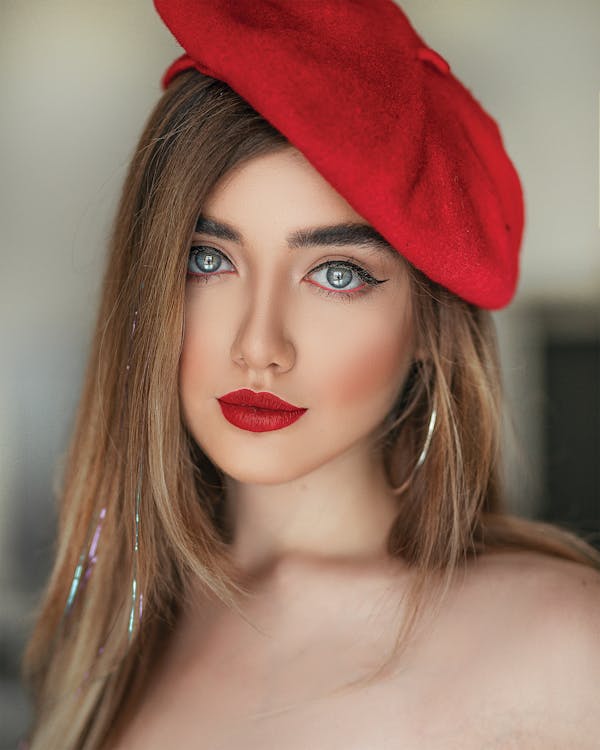 Free Portrait Photo of Woman in Red Lipstick and Red Beret Hat Posing Stock Photo