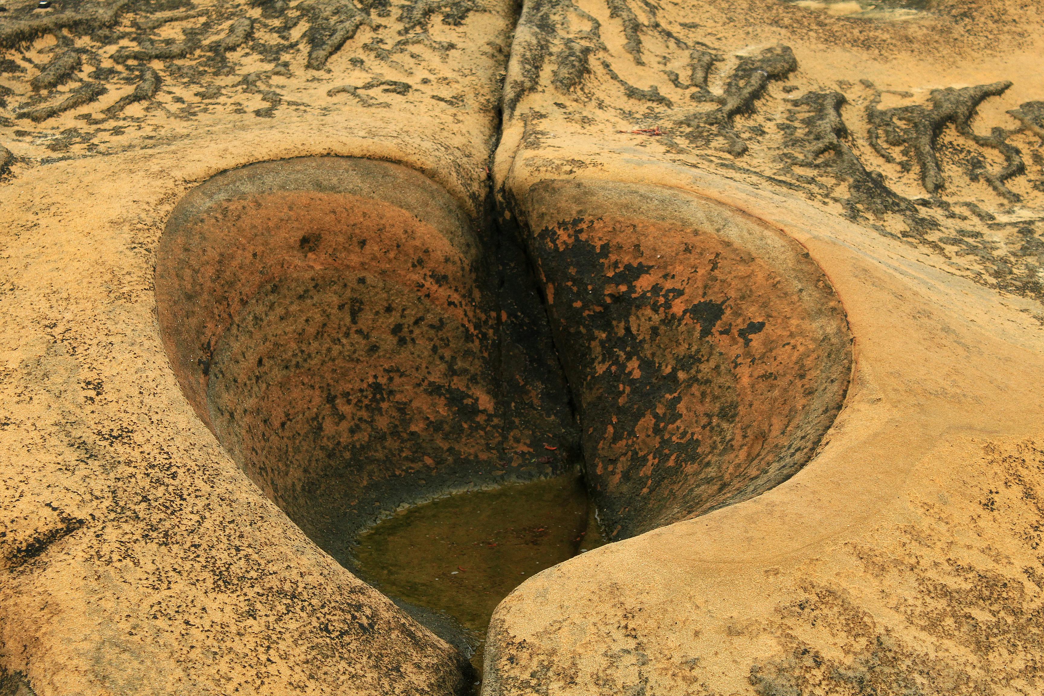 a large rock with a hole in it