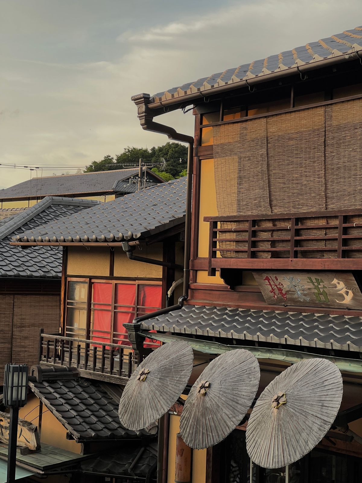 Traditional Japanese white-walled architecture along a quiet historical district