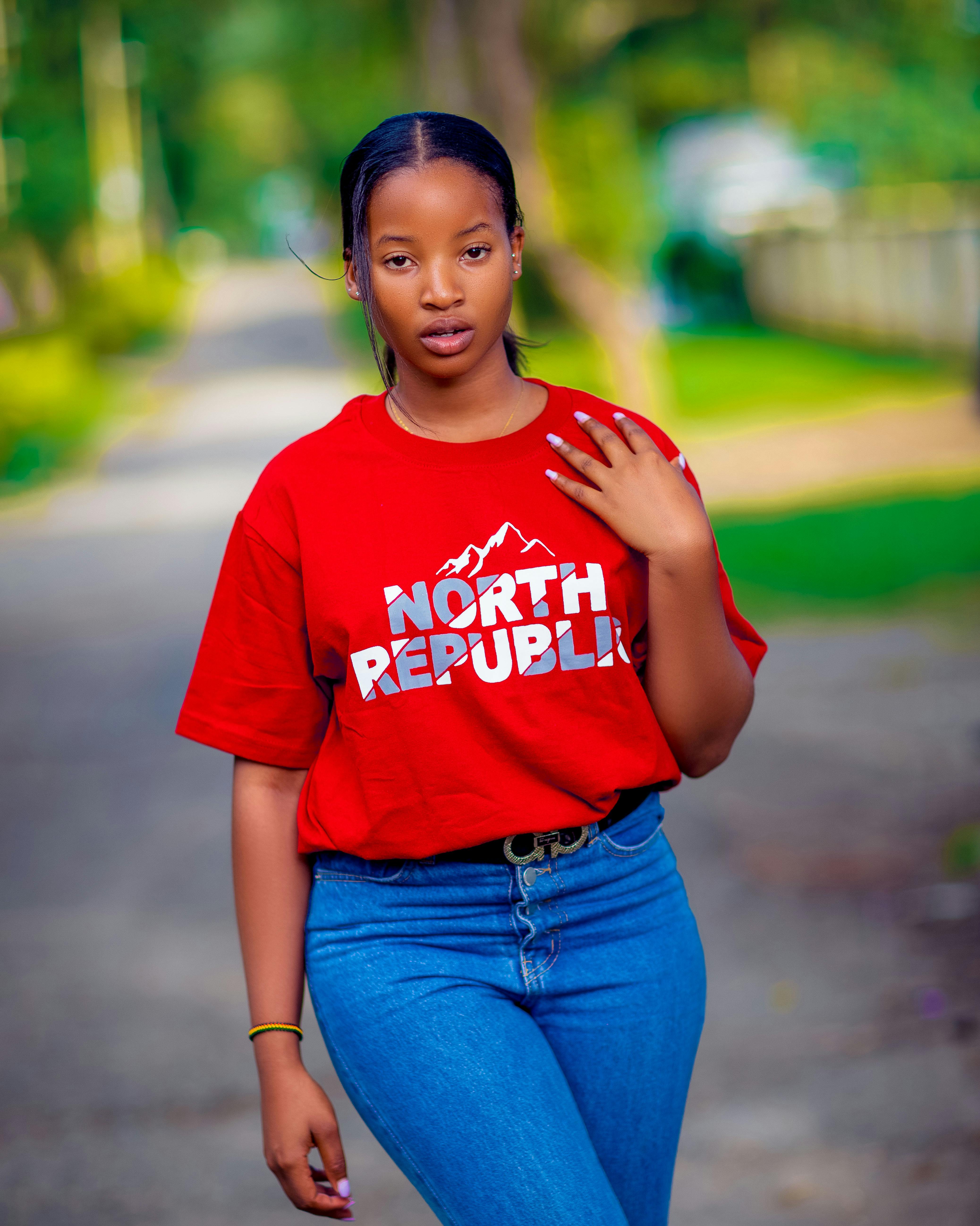 a young woman wearing a red shirt with the word north republic