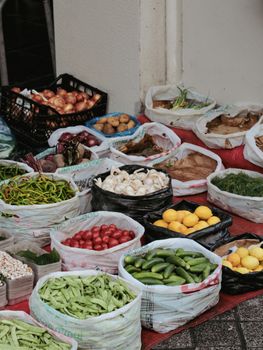 A vibrant market stall showcasing a diverse array of fresh fruits and vegetables.. vibrant, market, stall