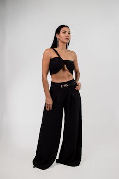 Elegant portrait of a woman in a trendy black outfit posing confidently.