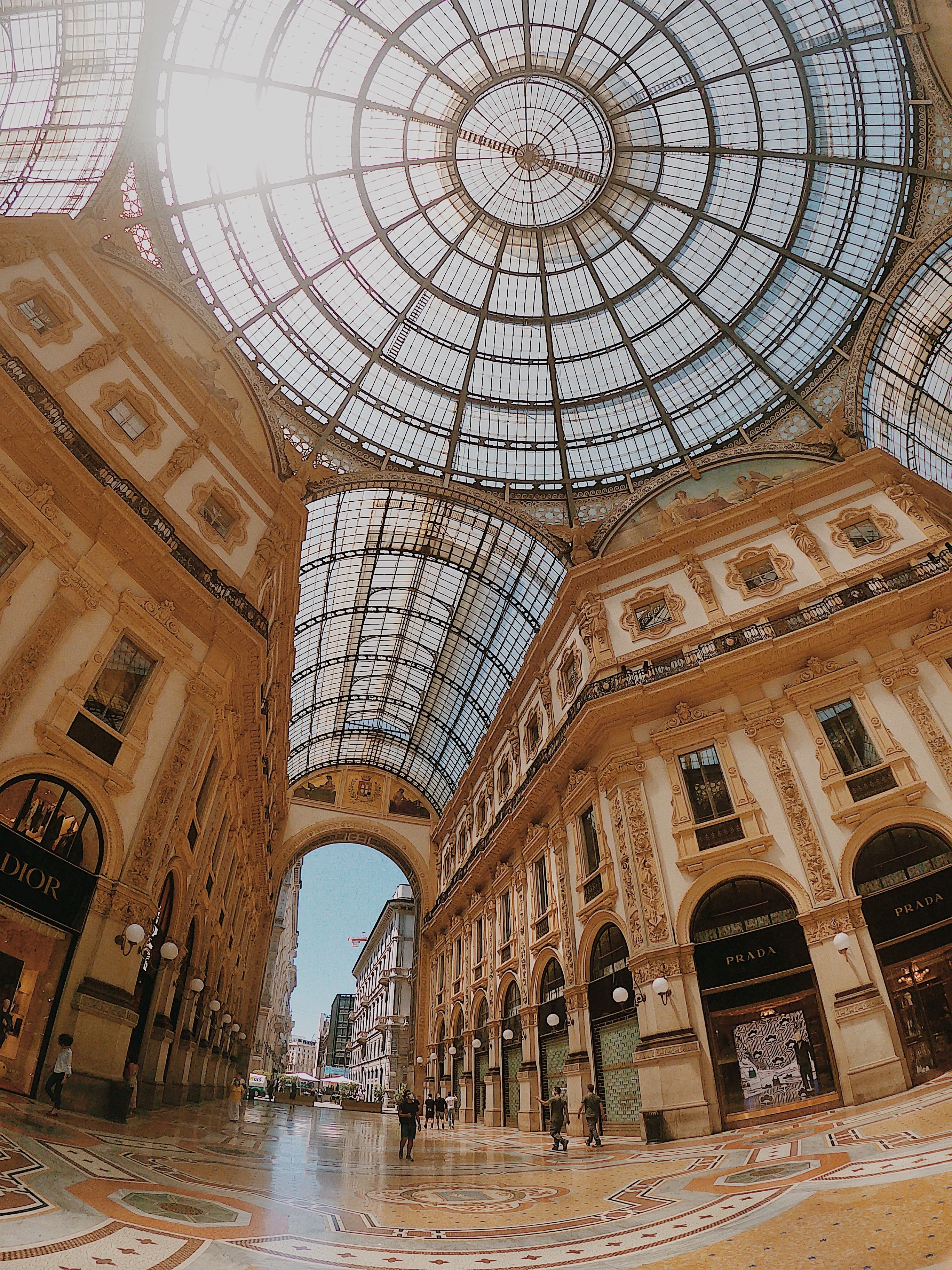 Explore the iconic Galleria Vittorio Emanuele II in Milan, featuring its grand architectural design and famous glass dome.