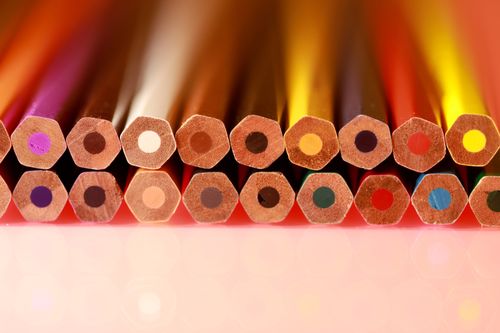 Free Bright multicolored hexagonal wooden pencils arranged neatly in rows. Ideal for education and art themes. Stock Photo