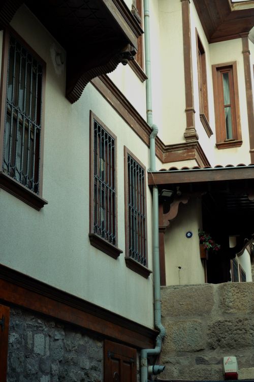 Free Vertical view of traditional houses with iron bars on windows. Stock Photo