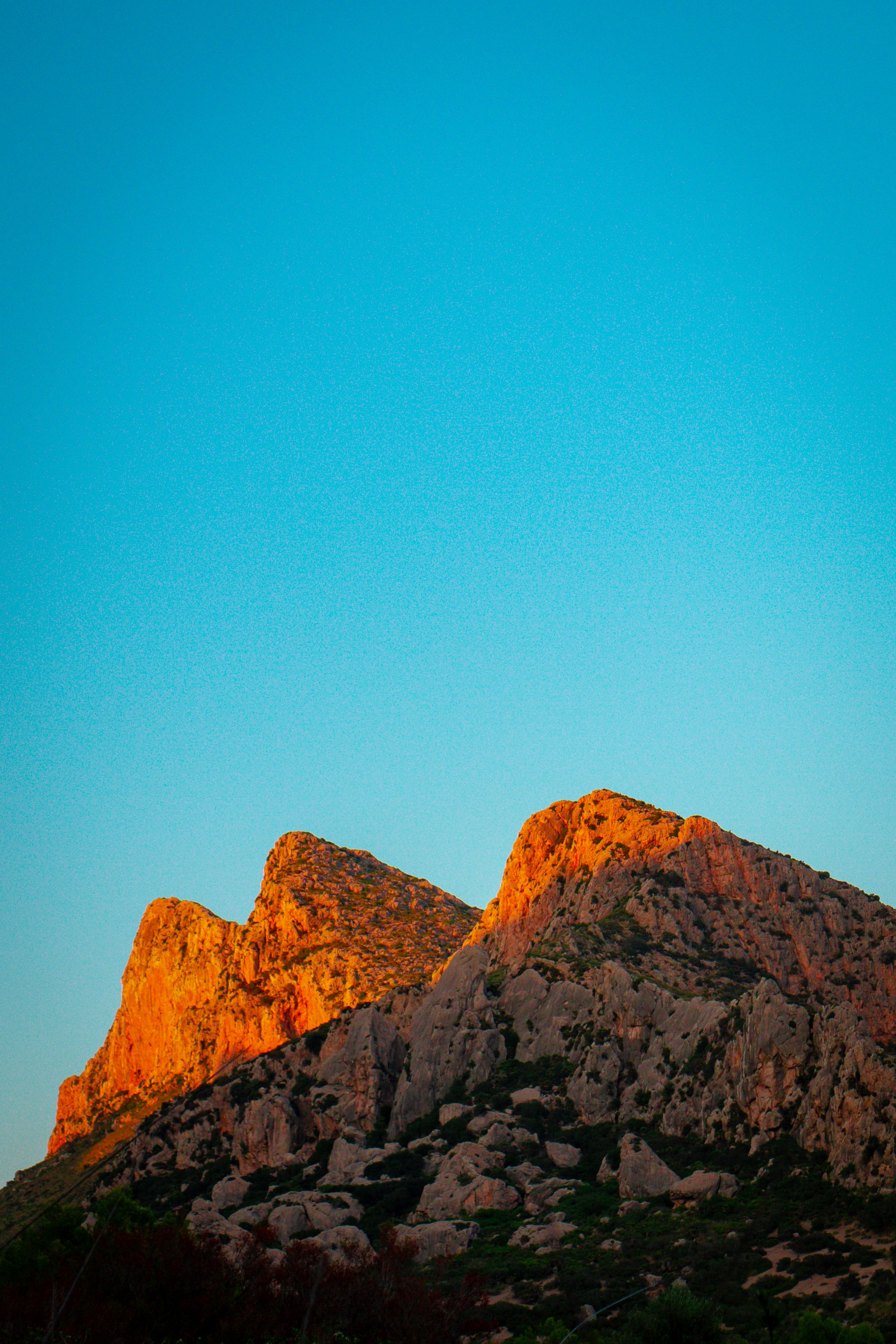 Brown Rocky Mountain Under the Blue Sky · Free Stock Photo