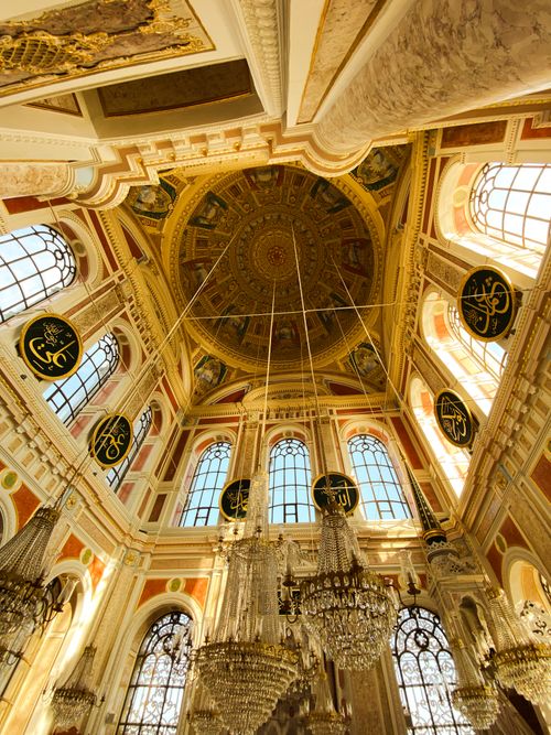 Free Intricate details of a mosque interior showcasing the ornate ceiling and stained glass windows. Stock Photo