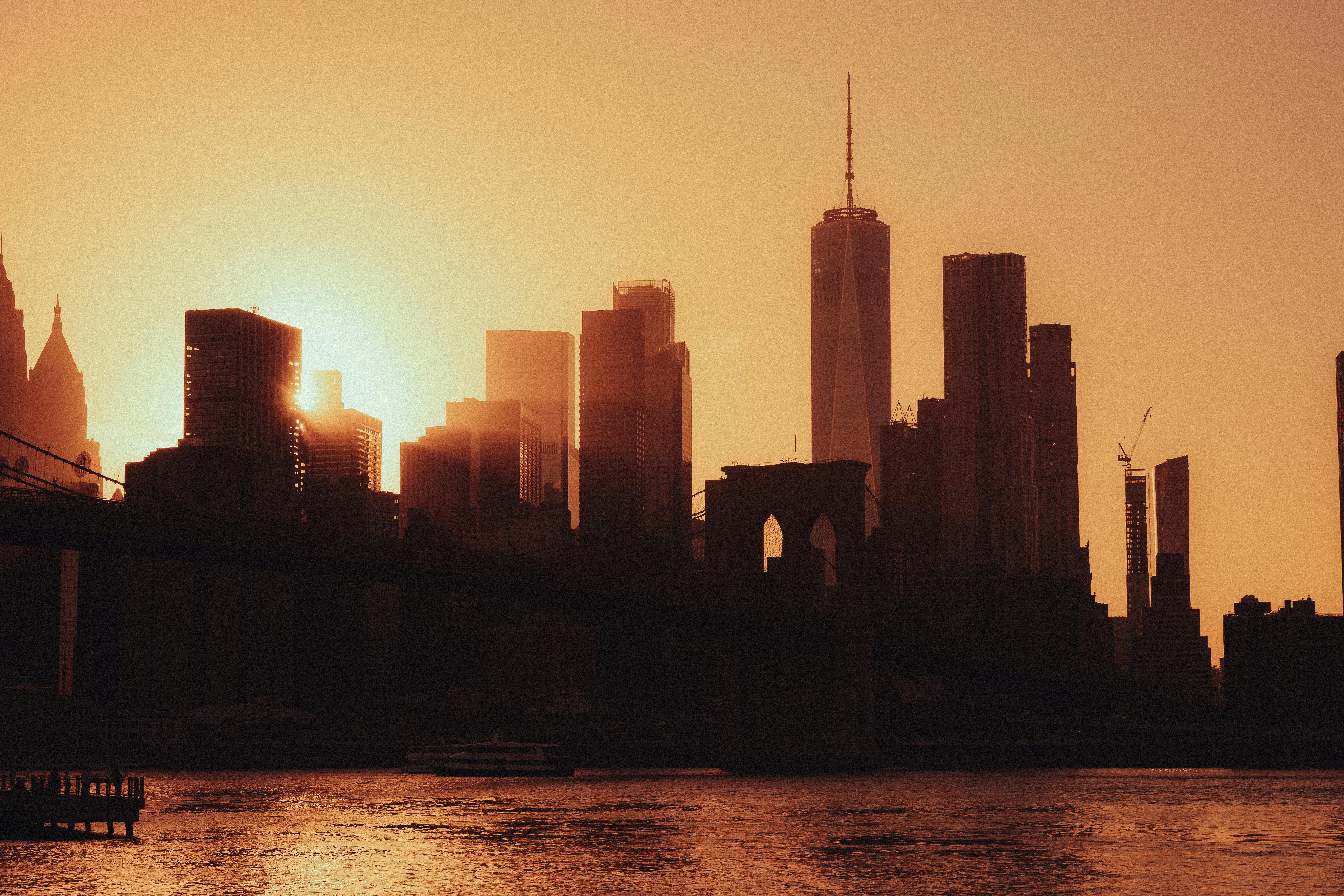 new york city skyline golden hour building silhouettes