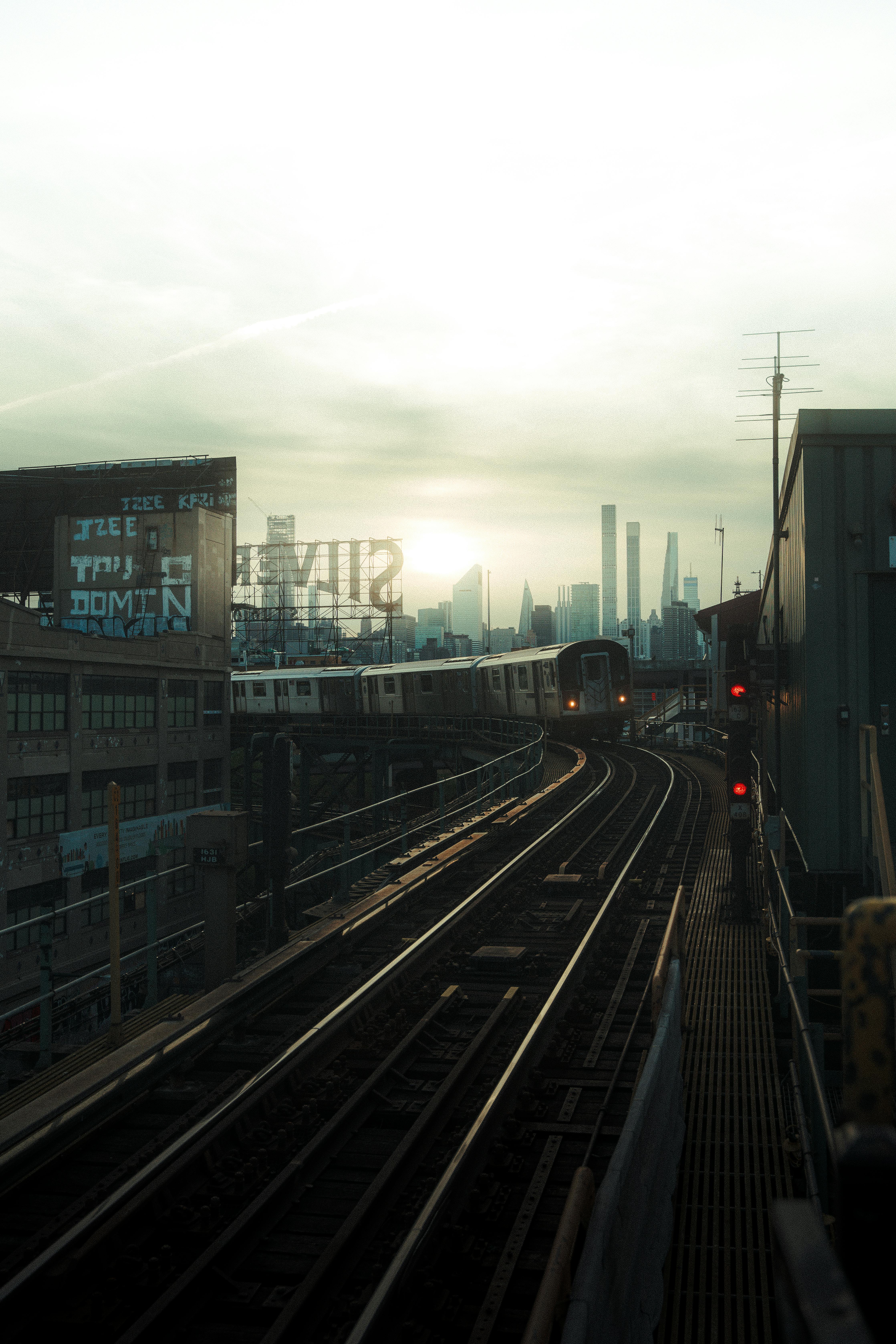 brooklyn train in front of new york city city skyline