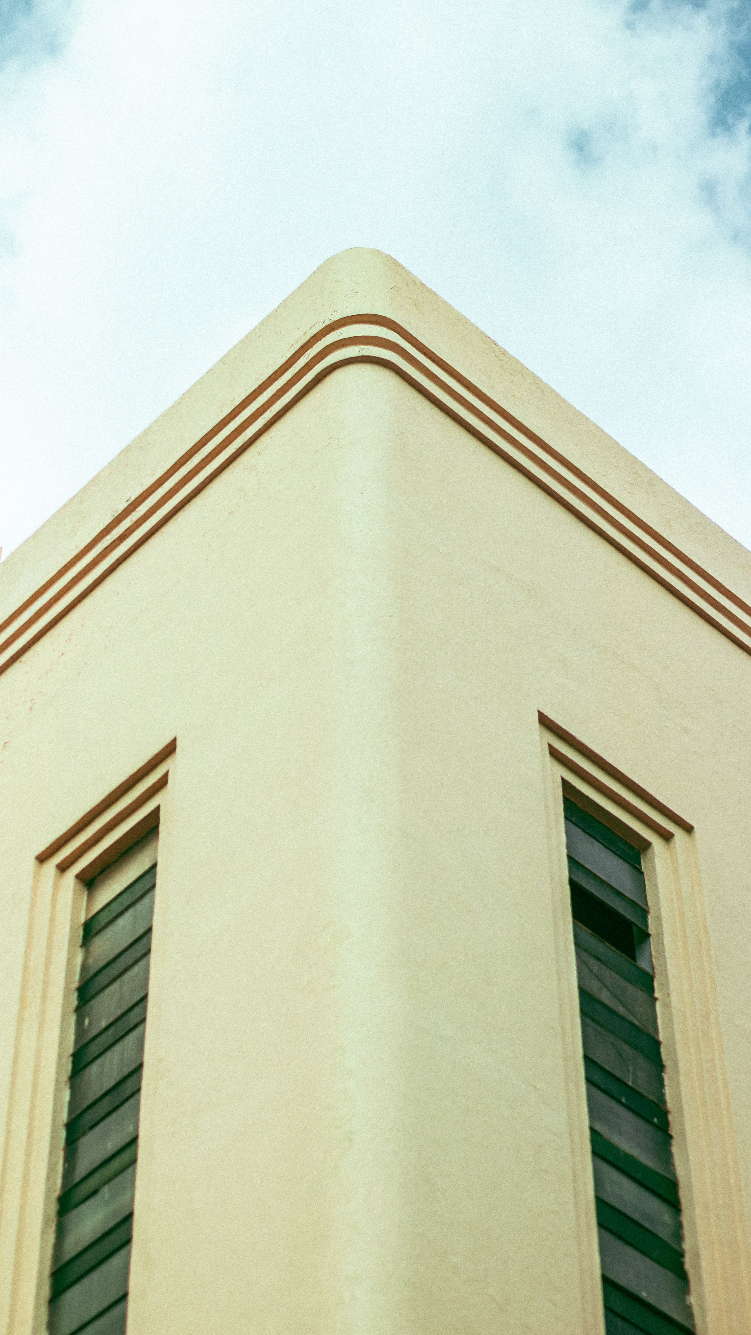 Close-up of an Art Deco building corner with geometric lines and pastel colors.. pexels, close, deco