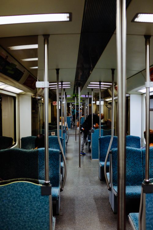Free People commuting inside a modern subway train. Urban public transportation in a city. Stock Photo