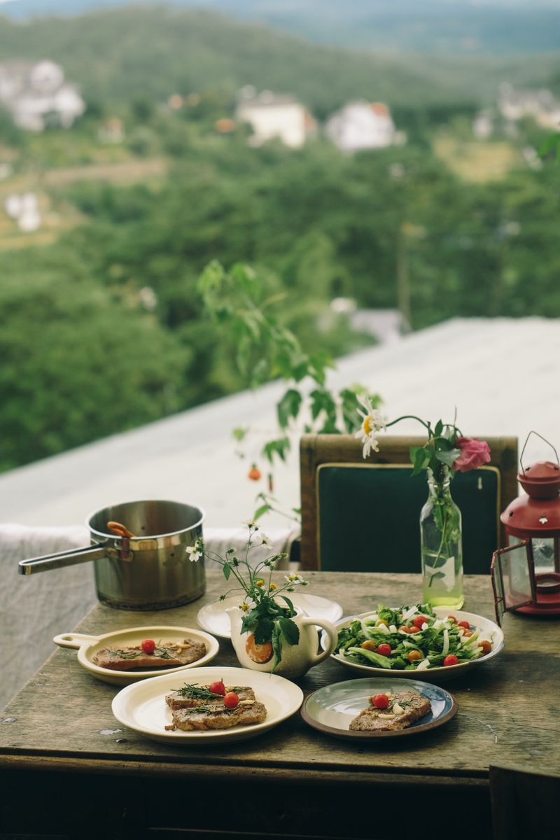 Plates of fresh summer food on a wooden table