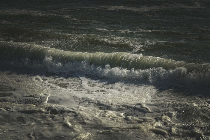 Dark ocean waves with white foam — photo by Francesco Ungaro on Pexels