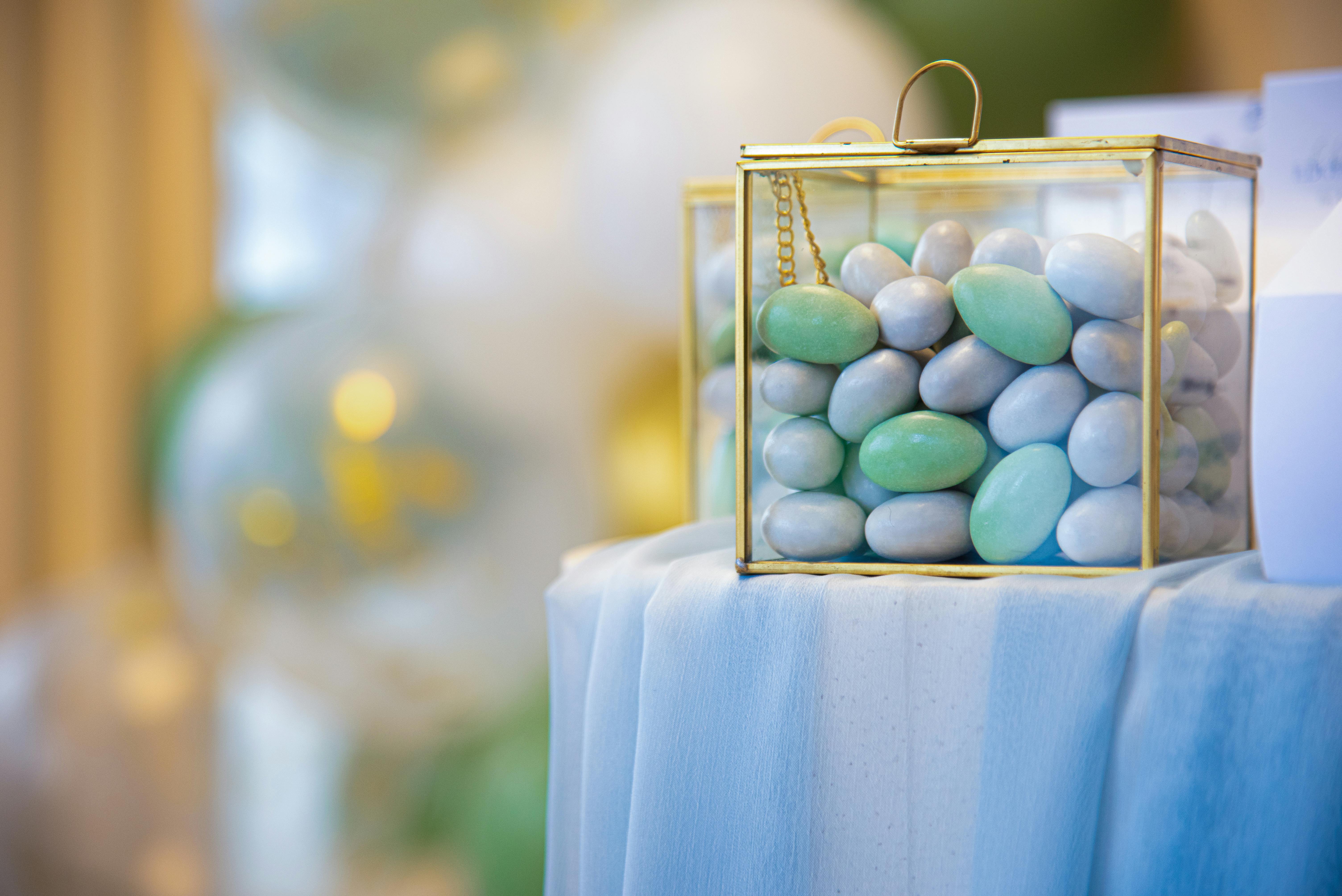 a small box filled with blue and green candies