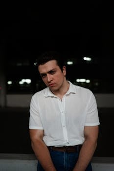 A thoughtful portrait of a man in a white shirt taken in Ankara, Turkey.