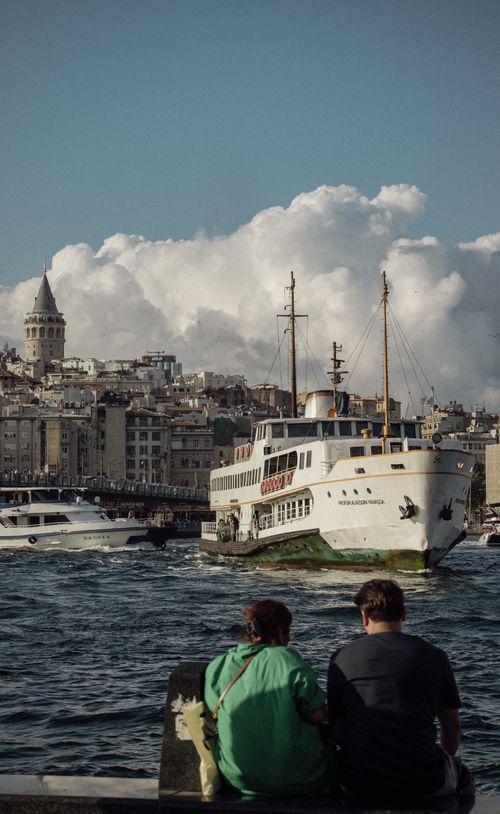 Free Scenic view of boats on the Bosphorus in Istanbul, with Galata Tower and cityscape in the background. Stock Photo