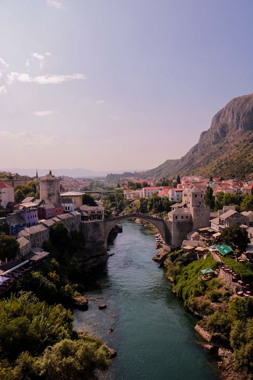 Free Scenic view of the historic Old Bridge and Neretva River in Mostar, Bosnia and Herzegovina. Stock Photo