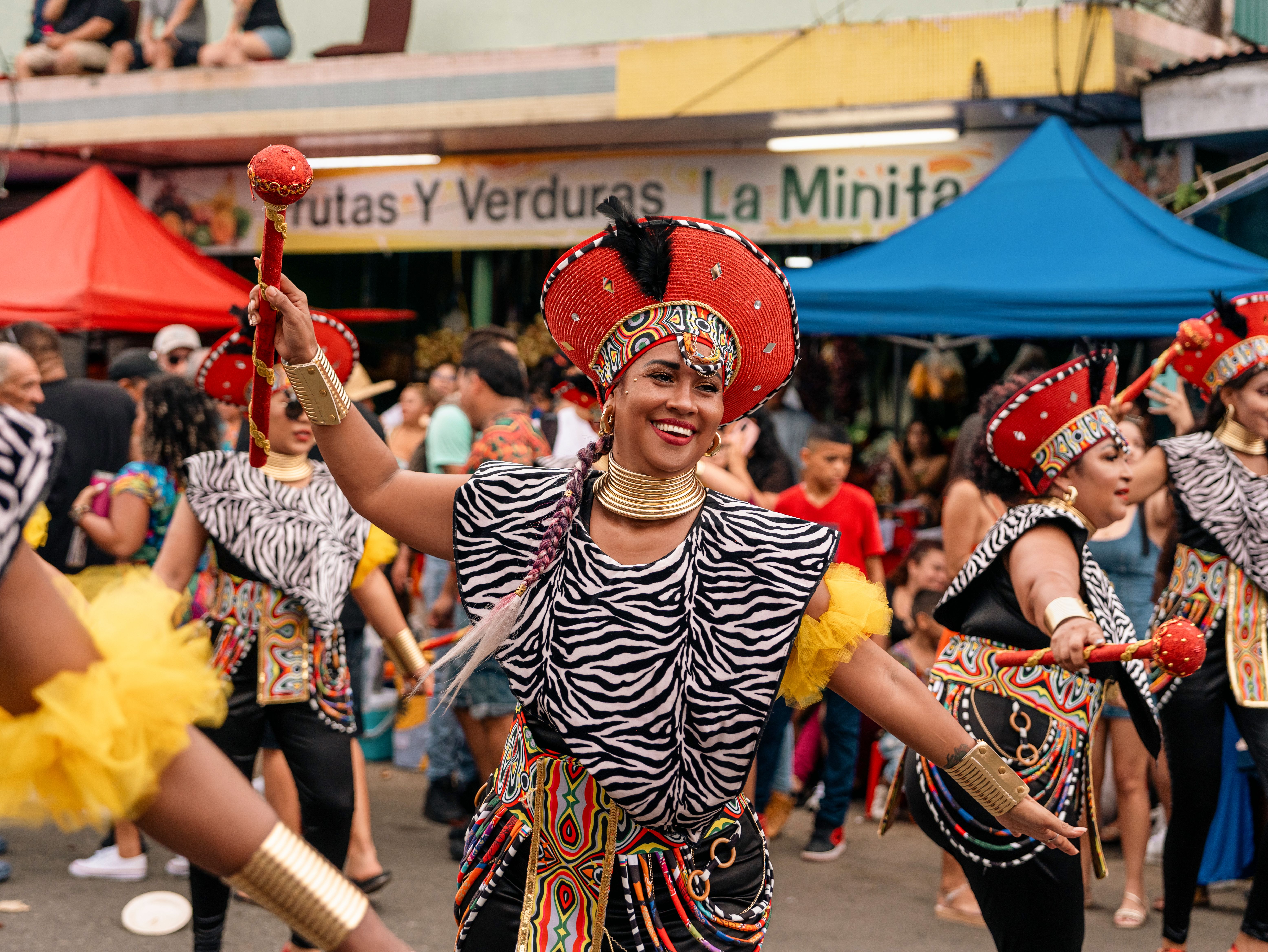 Vibrant dancers celebrate Afro-Costa Rican heritage during a colorful street parade in Limón, Costa Rica.