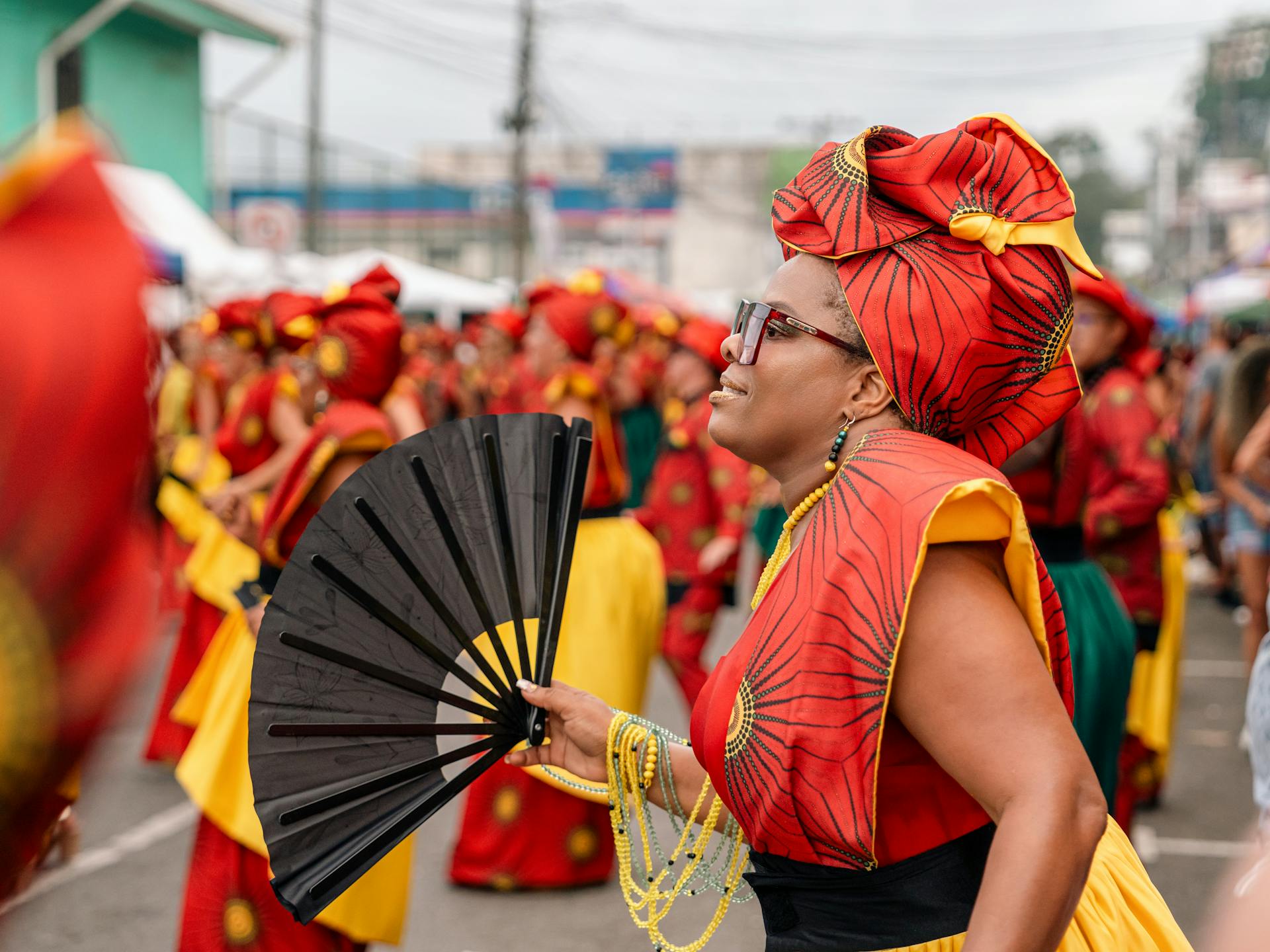 Vibrant carnival celebration in Limón, Costa Rica with dancers in traditional costumes.