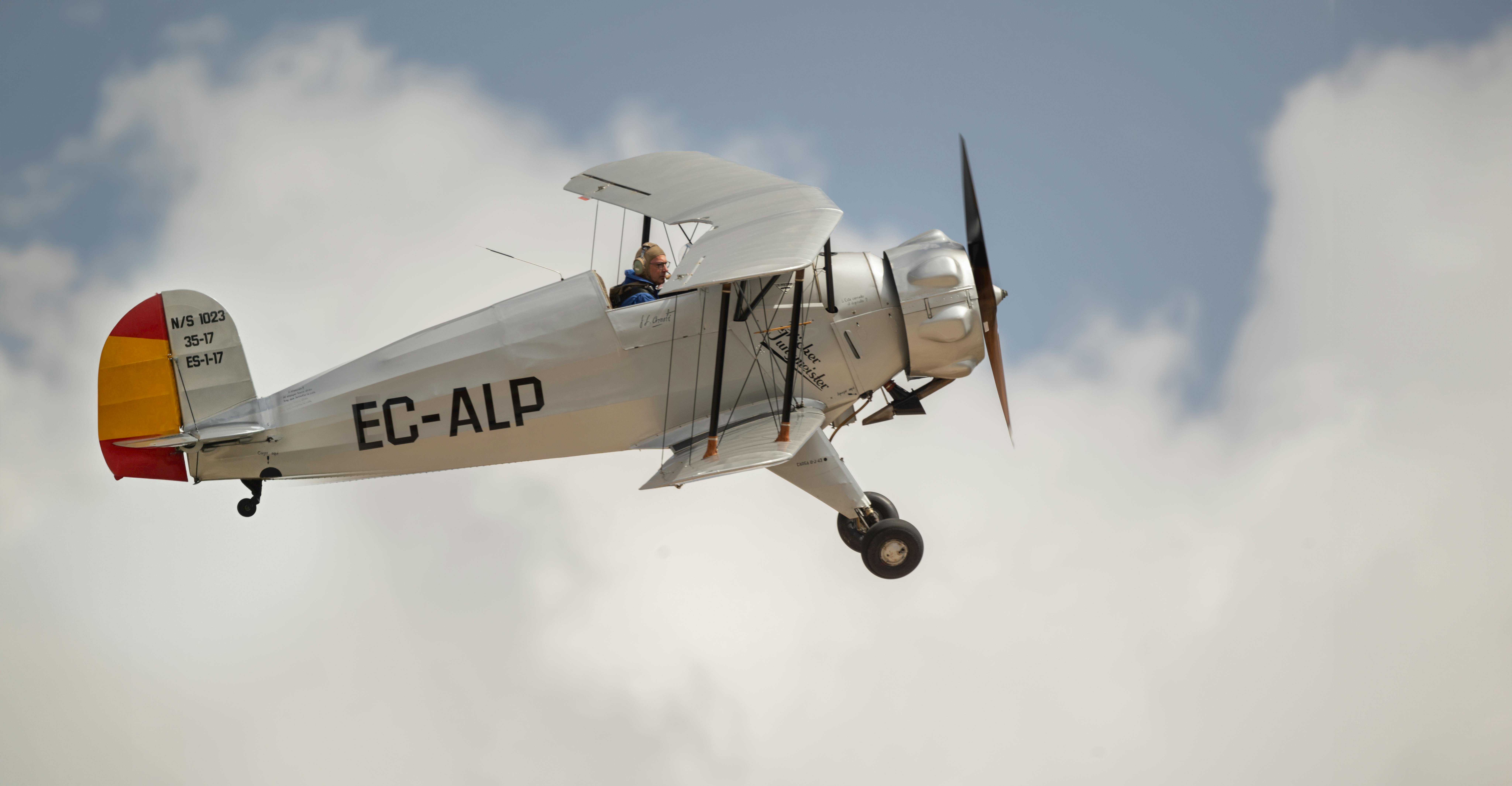 a small airplane flying in the sky