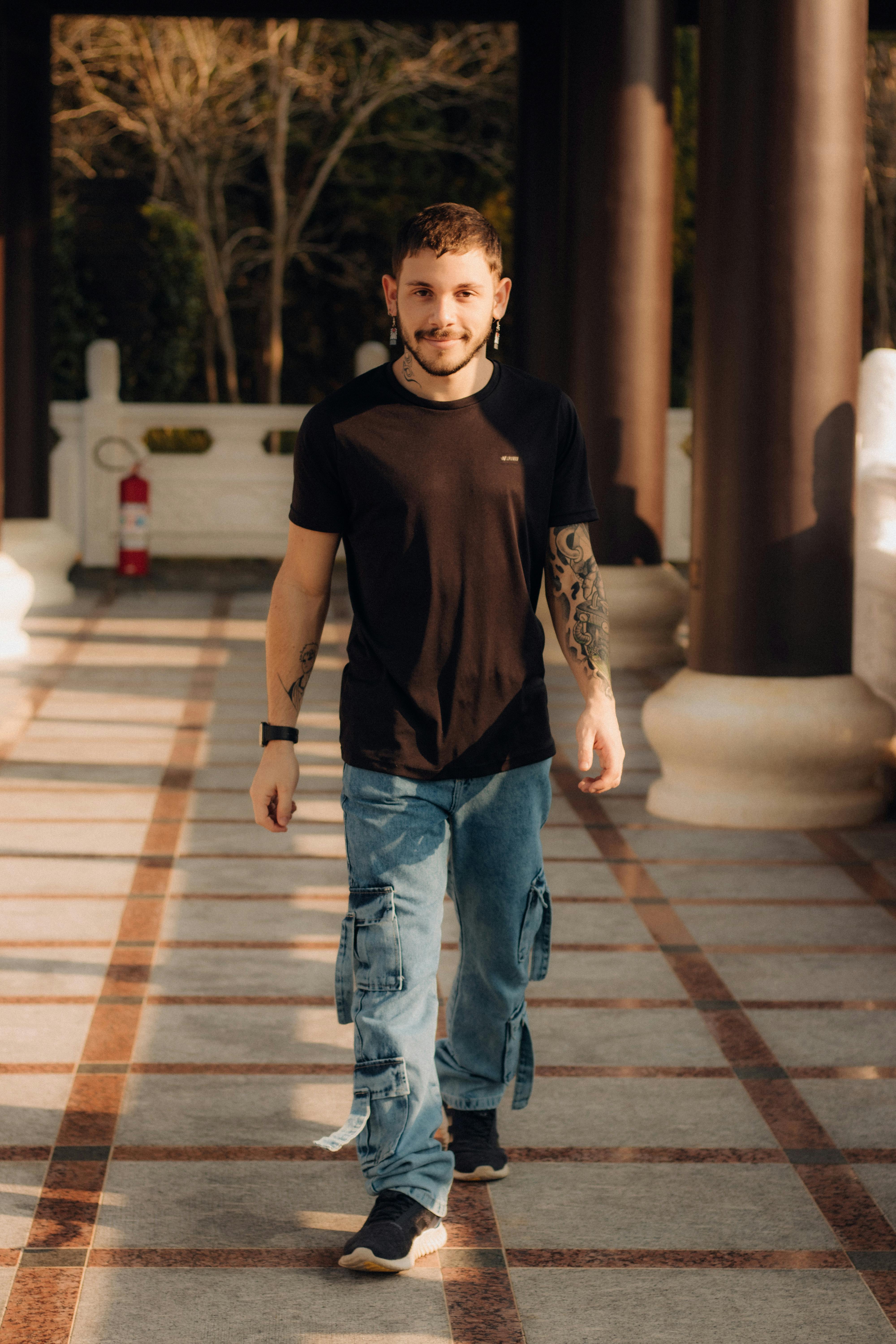 a man walking down a path with a beard