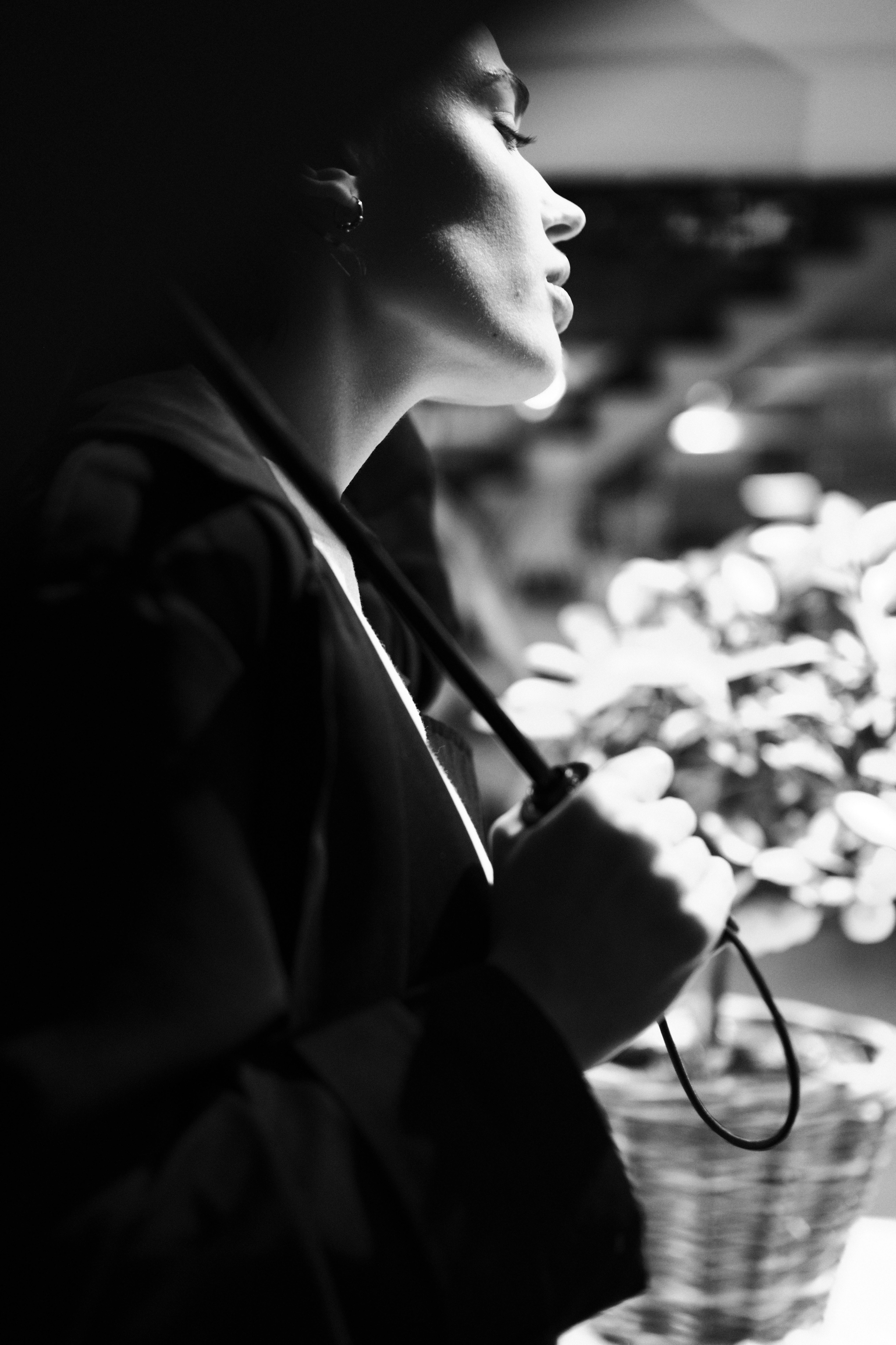 a woman is looking at a flower arrangement