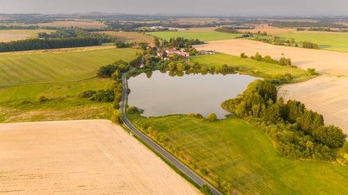 Free Aerial view of a serene countryside landscape in Zbraslavice, Czech Republic with fields and a lake. Stock Photo