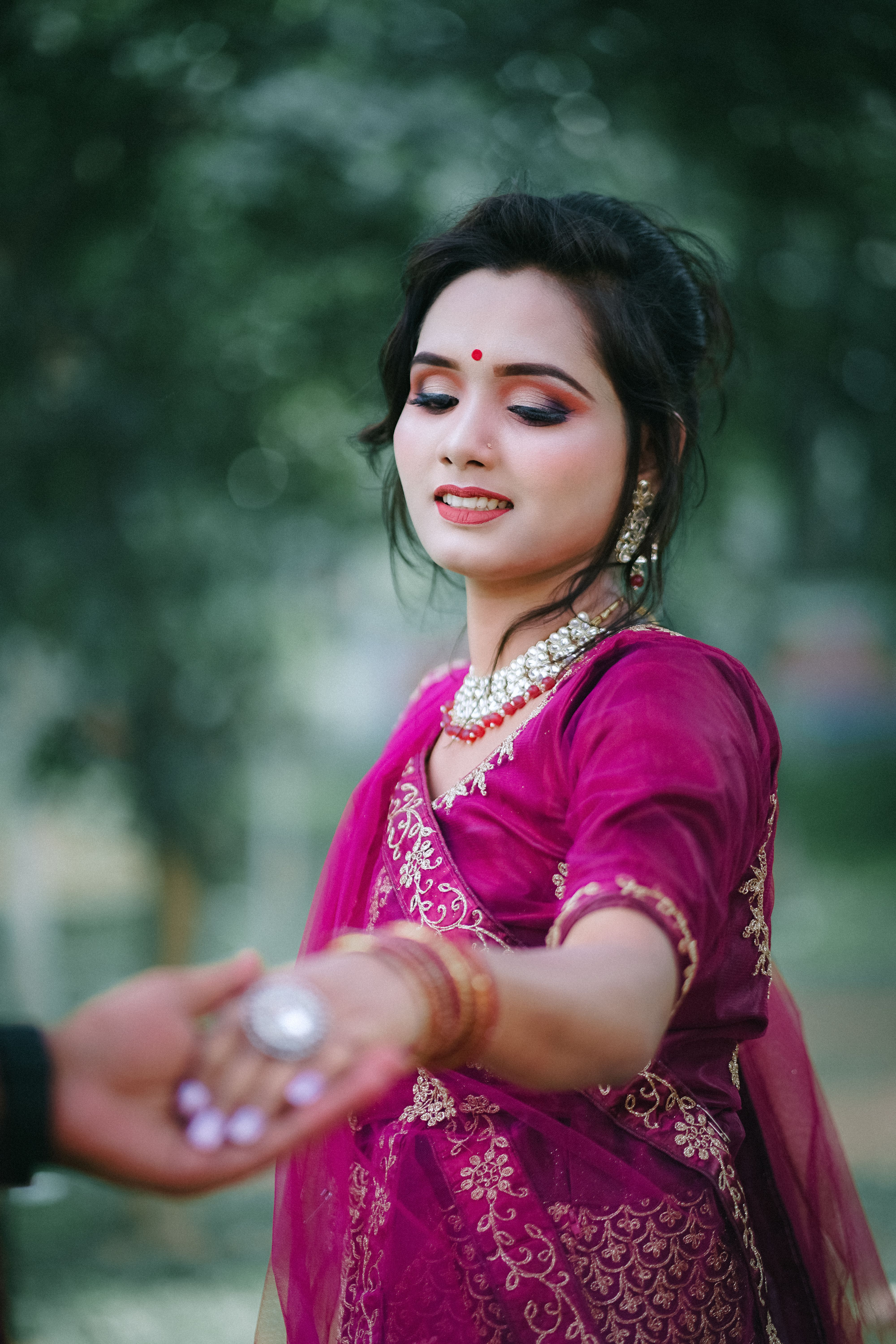 A beautiful indian woman in a pink sari · Free Stock Photo