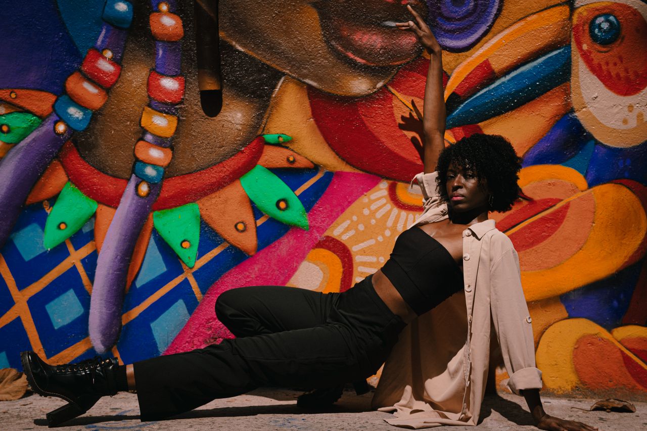 artistic street dance pose against colorful graffiti in s o paulo braz