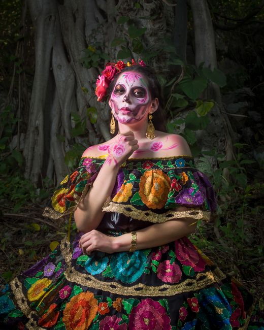 Colorful Dia de los Muertos Catrina in Mexican traditional attire, set in mystical forest.