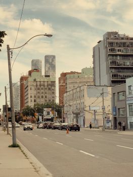 Capture of Toronto's urban cityscape featuring modern skyscrapers and busy street life.