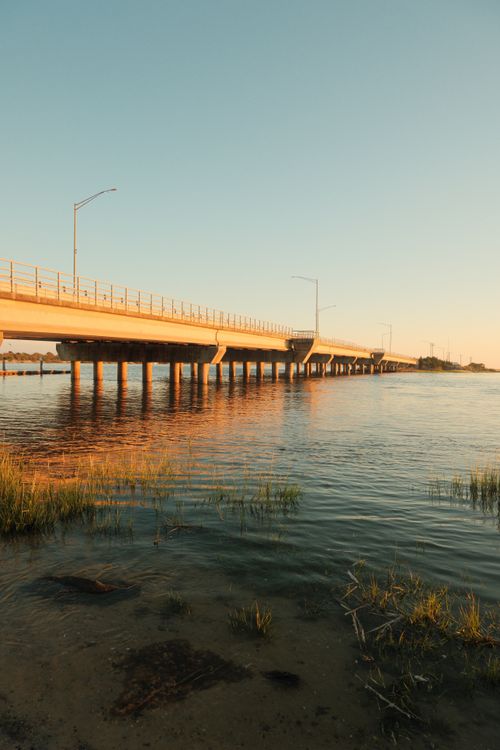 Free Dramatic view of Houghton Highway Bridge over calm waters at dusk in Australia. Stock Photo