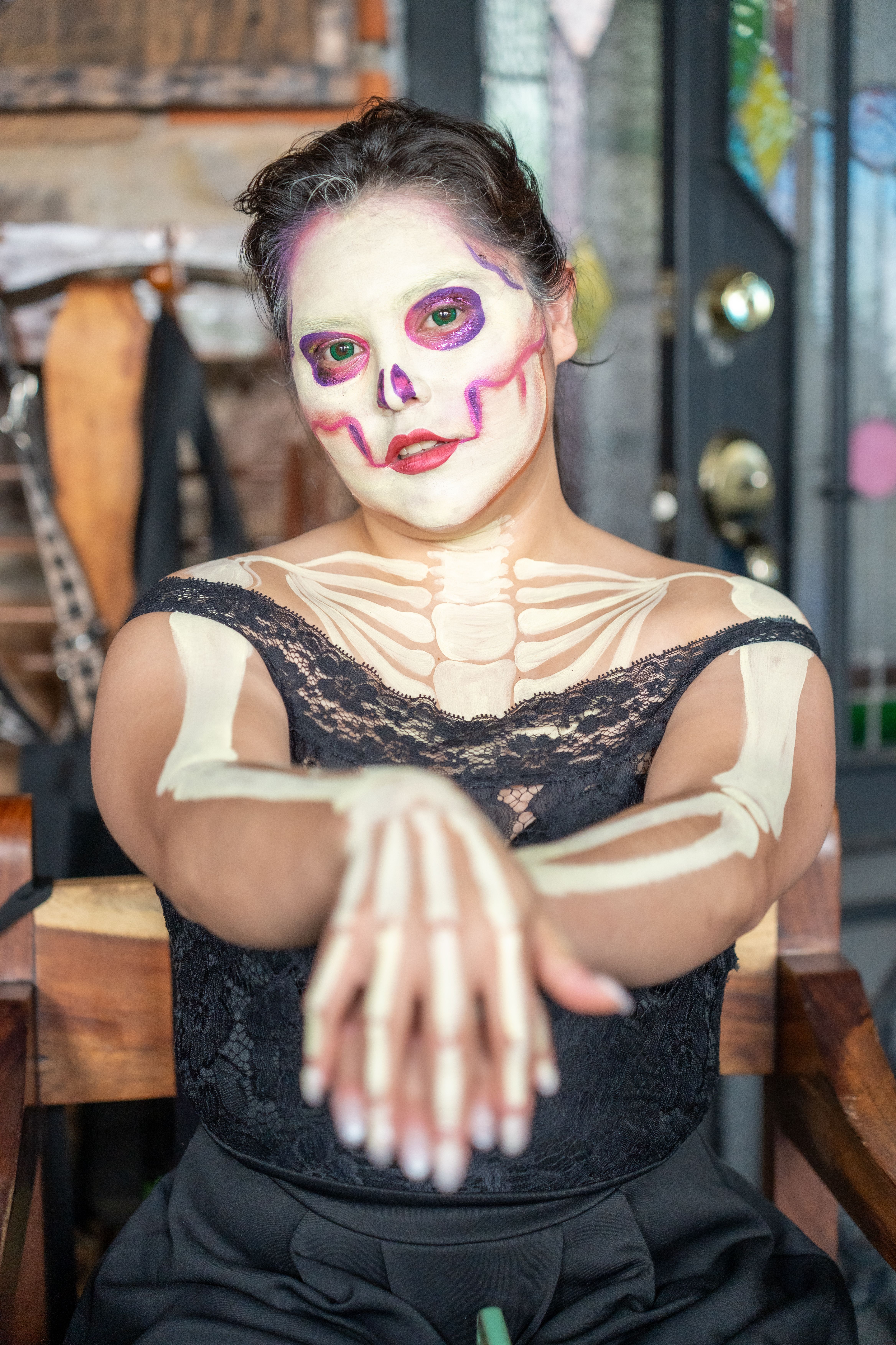 A woman with skeleton makeup and a skeleton dress · Free Stock Photo