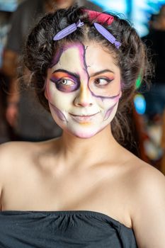 Beautiful portrait of a woman with Catrina makeup in Mexico City, capturing cultural elegance and fashion.
