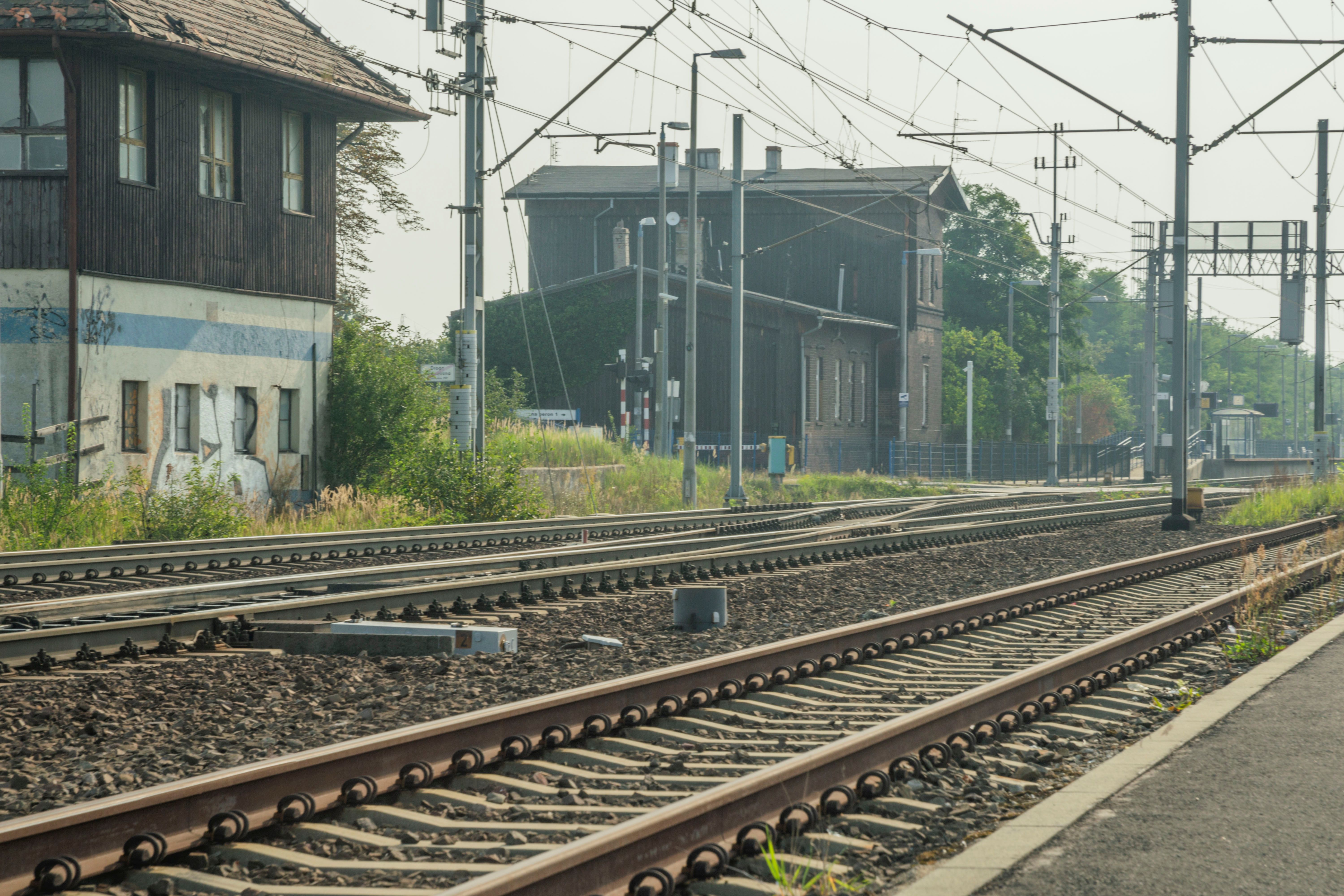 Rustic railway tracks leading to Wrocław station, Poland, showcasing transportation infrastructure.