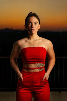 Striking portrait of a woman in a red outfit captured beautifully at sunset in Austin.