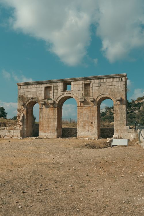 Free Explore ancient ruins with arches in Kaş, Antalya, Türkiye. Perfect for travel and history enthusiasts. Stock Photo