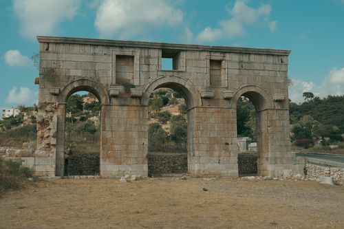 Free Roman arch ruins in Kaş, Antalya, Türkiye, showcasing ancient architecture. Stock Photo