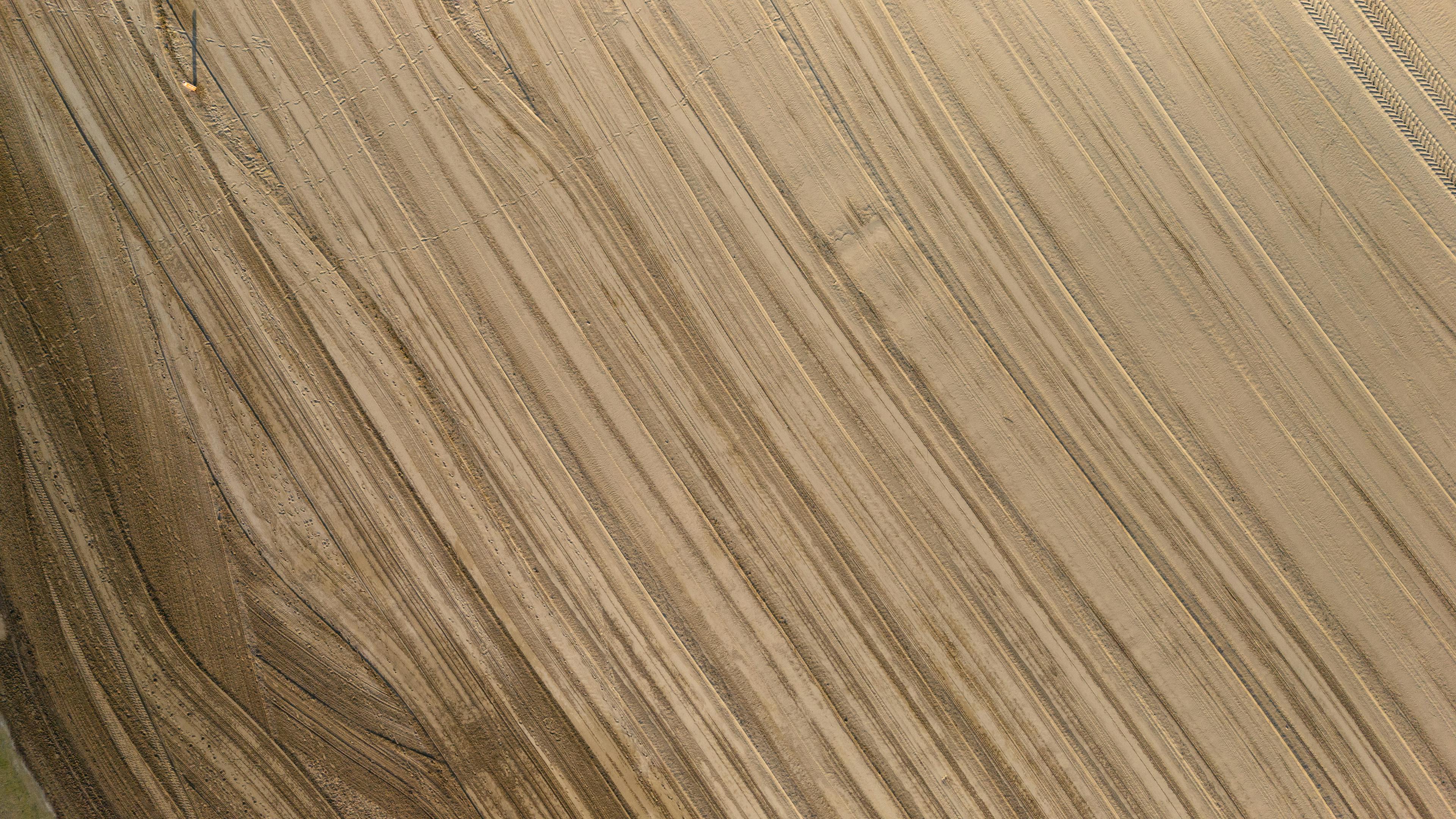 Free Aerial photograph showing the texture and patterns of a dry agricultural field in Caorle, Italy. Stock Photo