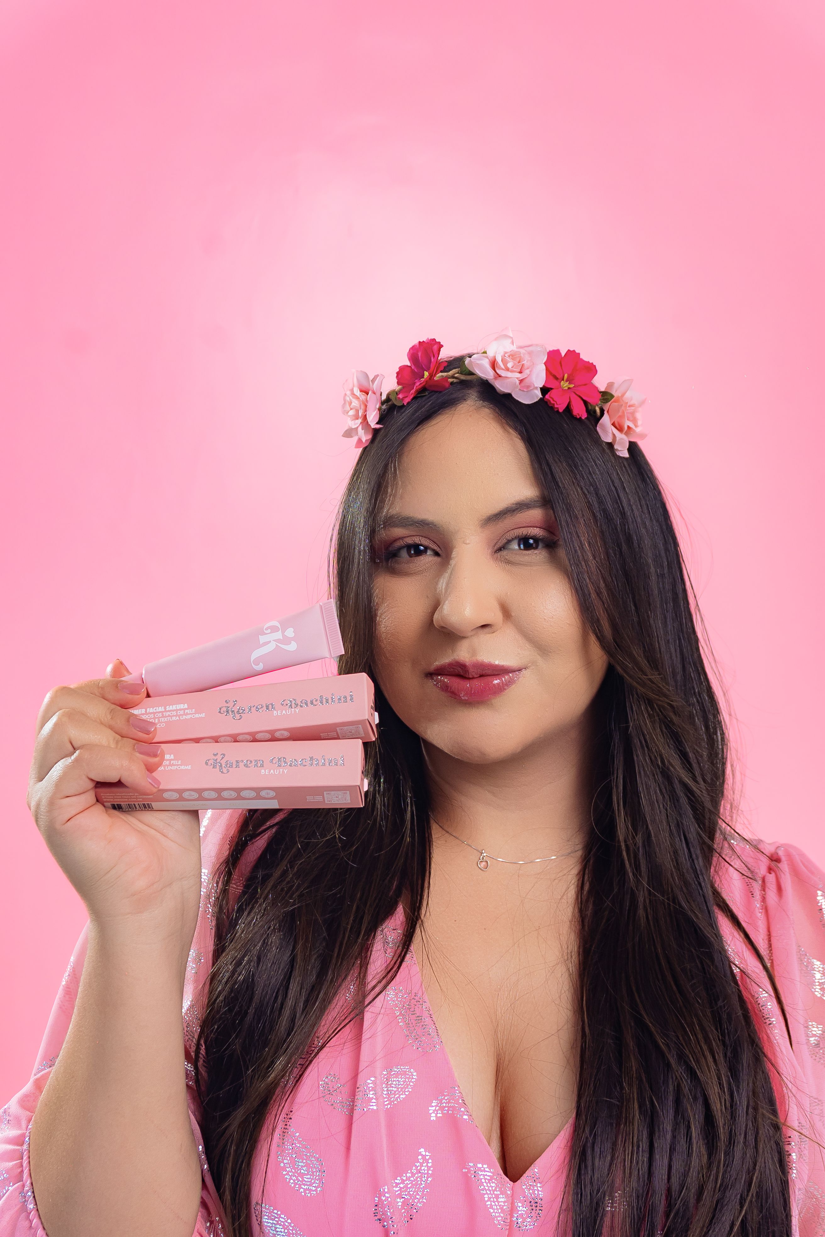 A woman holding up a bunch of pink roses · Free Stock Photo