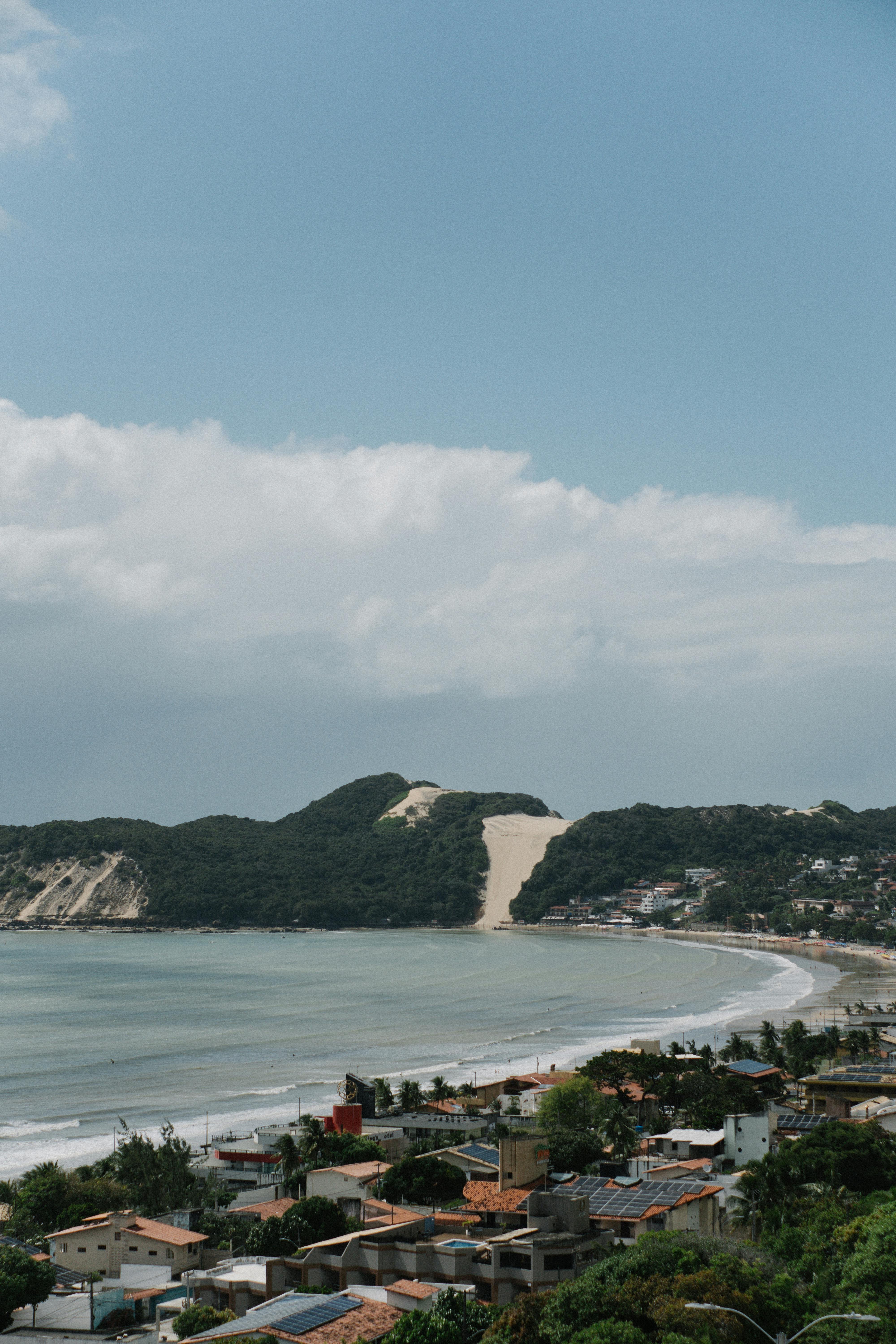 a beach and houses on the coast