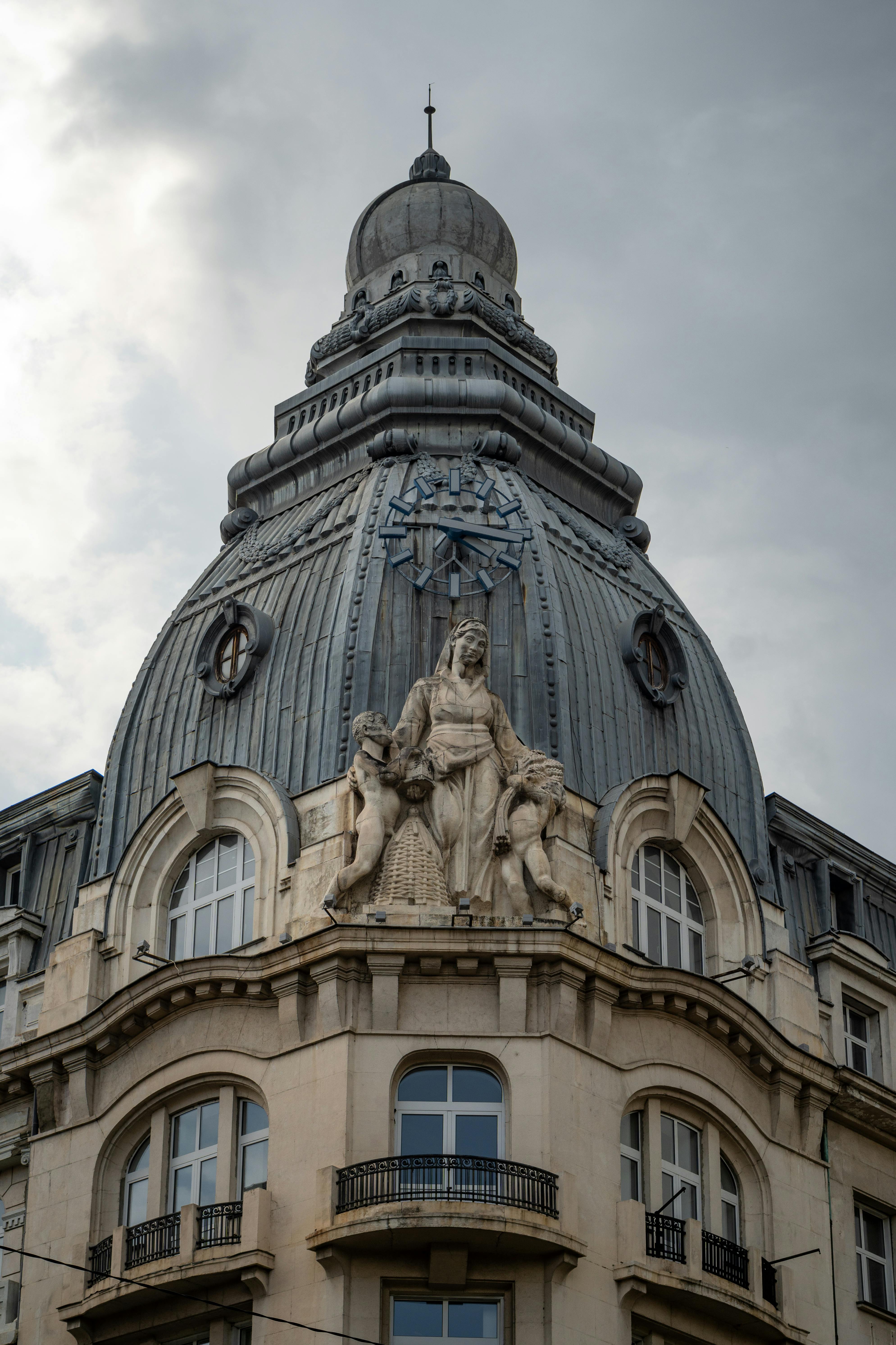 Free A dramatic view of a historical building dome in Sofia, showcasing intricate sculptures against a moody sky. Stock Photo