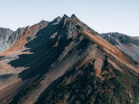 A breathtaking aerial view of a rugged mountain range in autumn. Perfect for nature lovers.