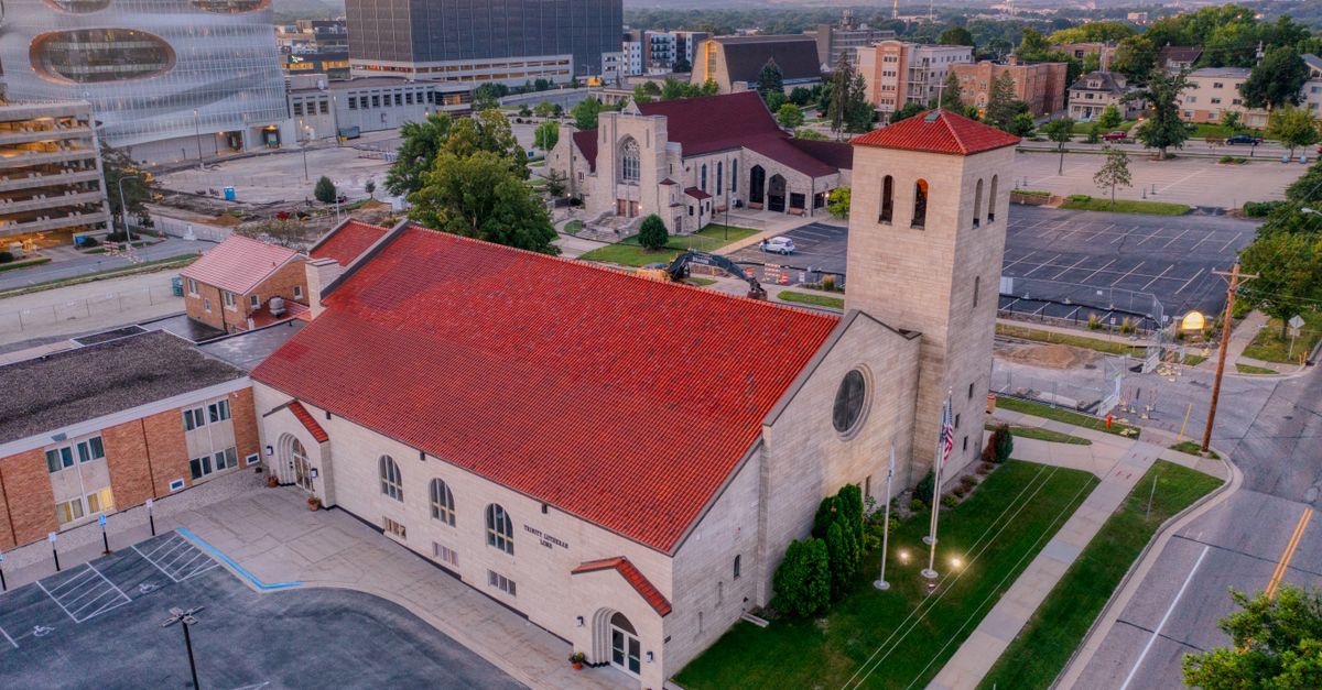 Stunning aerial view of a historic church in Rochester, MN during sunset.
