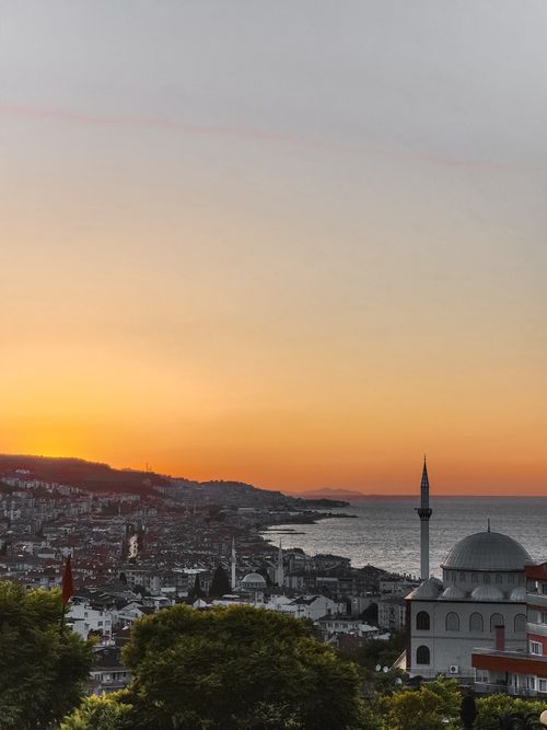 Free Beautiful sunset view over Mudanya, Bursa, featuring a mosque and sea. Stock Photo